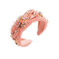 Pink knotted headband elegant adorned with sparkling teardrop and round crystals in a diamond-embedded high-grade design