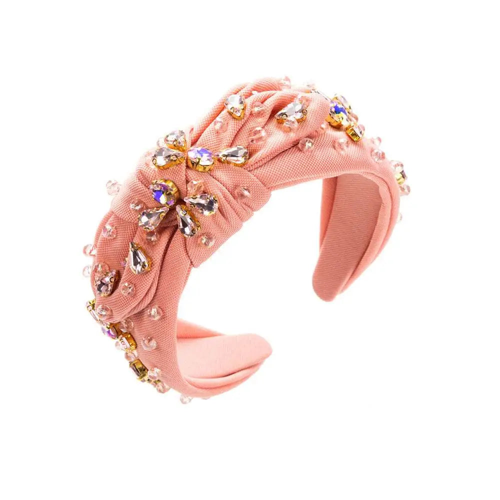 Pink knotted headband elegant adorned with sparkling teardrop and round crystals in a diamond-embedded high-grade design