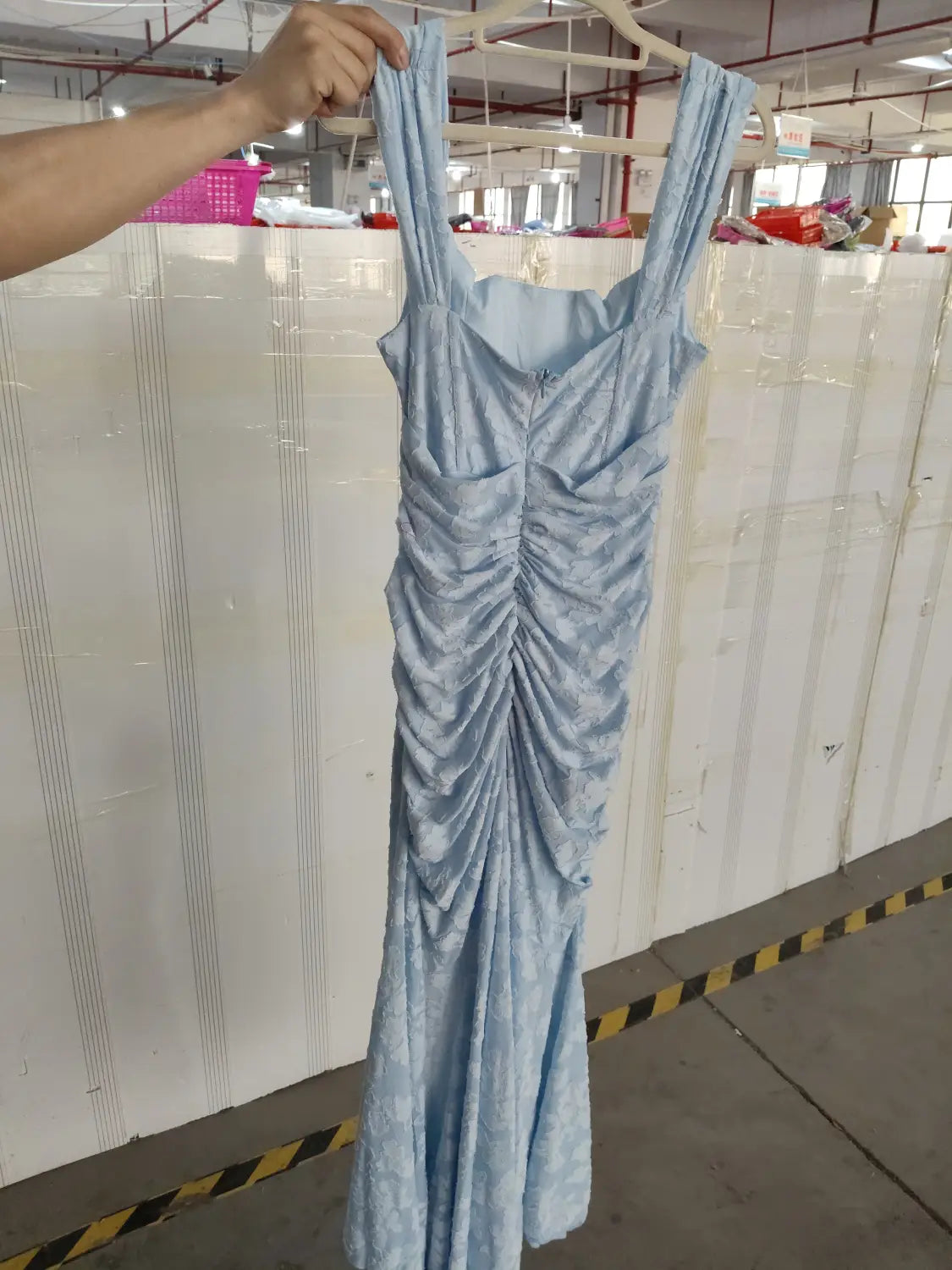 a light blue satin gown with a fitted bodice and ruched detailing down the front, perfect as a backless sexy evening dress or women purple sleeveless party outfit.
