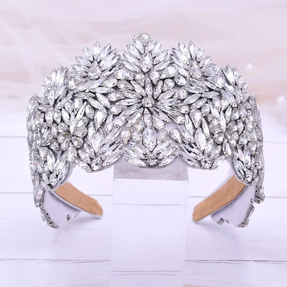 A silver floral rhinestone fashion retro headband featuring intricate leaf patterns and a flexible inner band for comfortable wear.