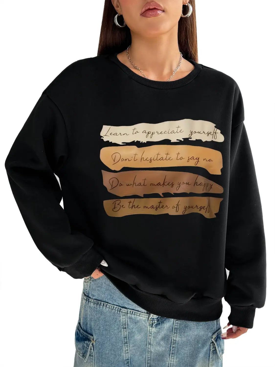 black oversized long sleeve sweatshirt with beige and gold motivational quotes printed on textured horizontal stripes ideal for daily wear solid colour