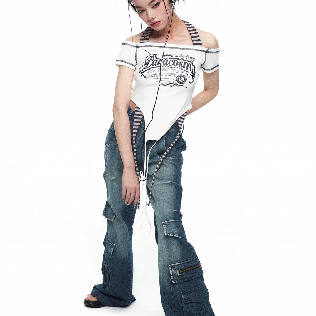 White off-the-shoulder cropped top with black graphic print and striped shoulder straps from spicy girls summer millennium collection in luxury women’s fashion.
