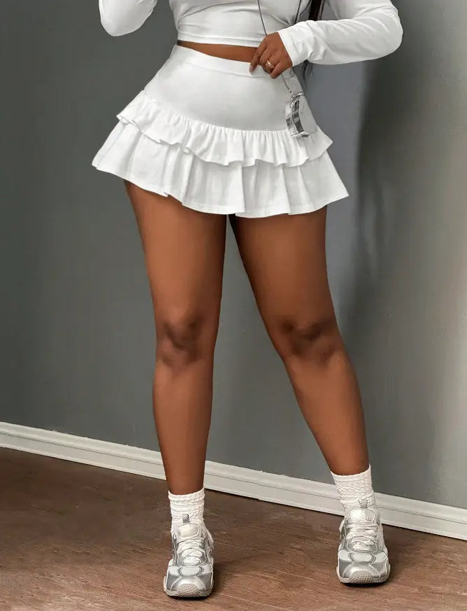 white ruffled tennis skirt featuring a fashionable stringy selvedge patchwork design for a hot girl fashionable look