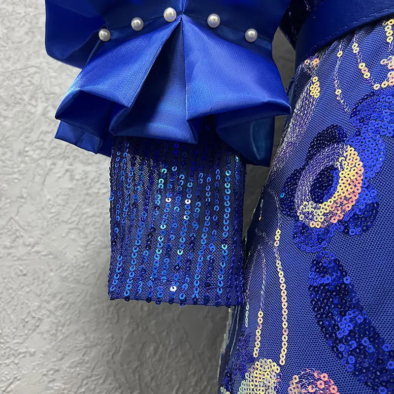 a vibrant royal blue satin half sleeve slim fit evening dress with a round neck shirt design featuring cascading sequins and pearl button accents