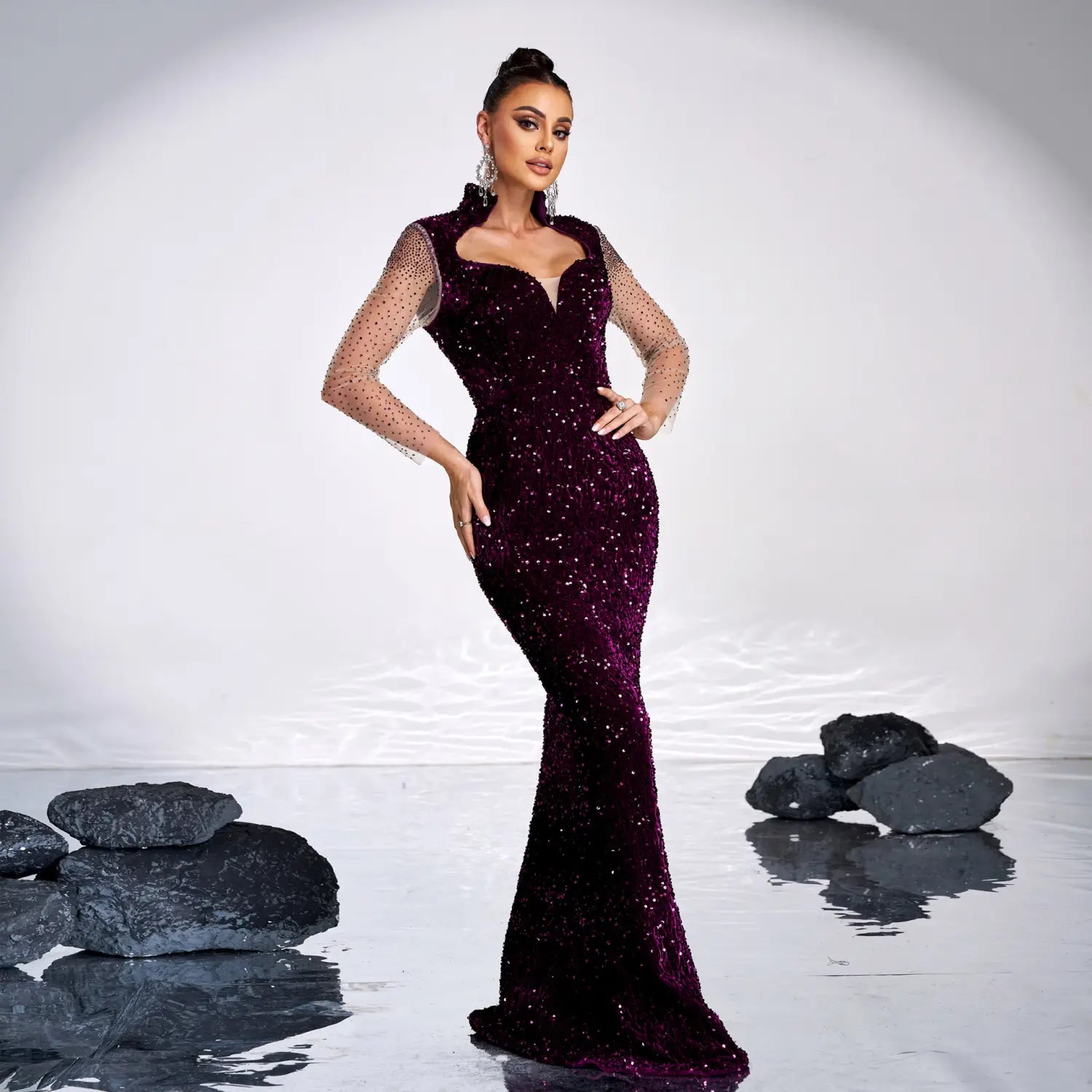 a shimmering burgundy long sleeve banquet sequined rhinestone fishtail dress with a fitted bodice, sheer mesh sleeves, and a floor length silhouette