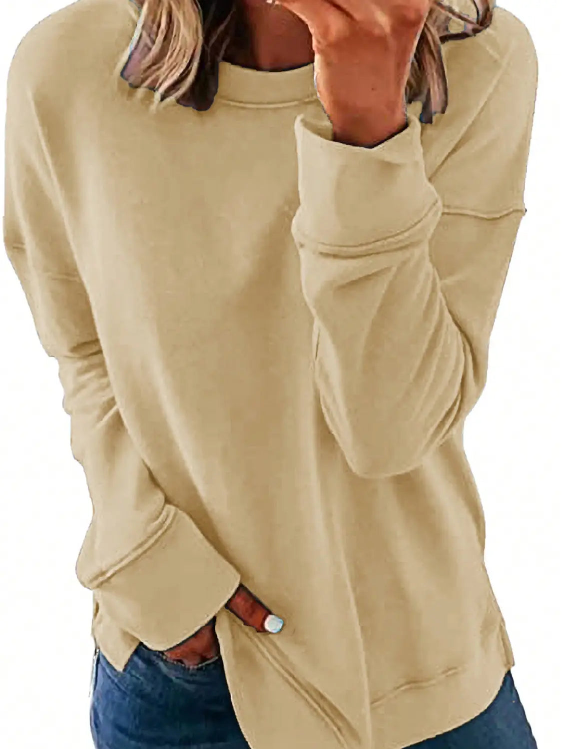 beige long-sleeved sweatshirt with ribbed cuffs and hem featuring a relaxed fit for womens sweatshirts fall fashion.