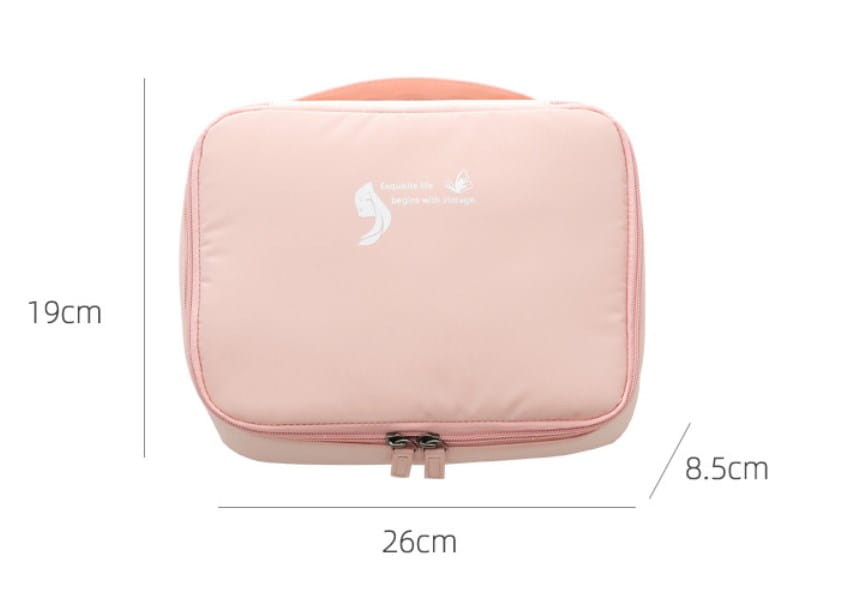 pink rectangular travel storage bag with matching handle and silver zipper pulls designed as a travel storage bag