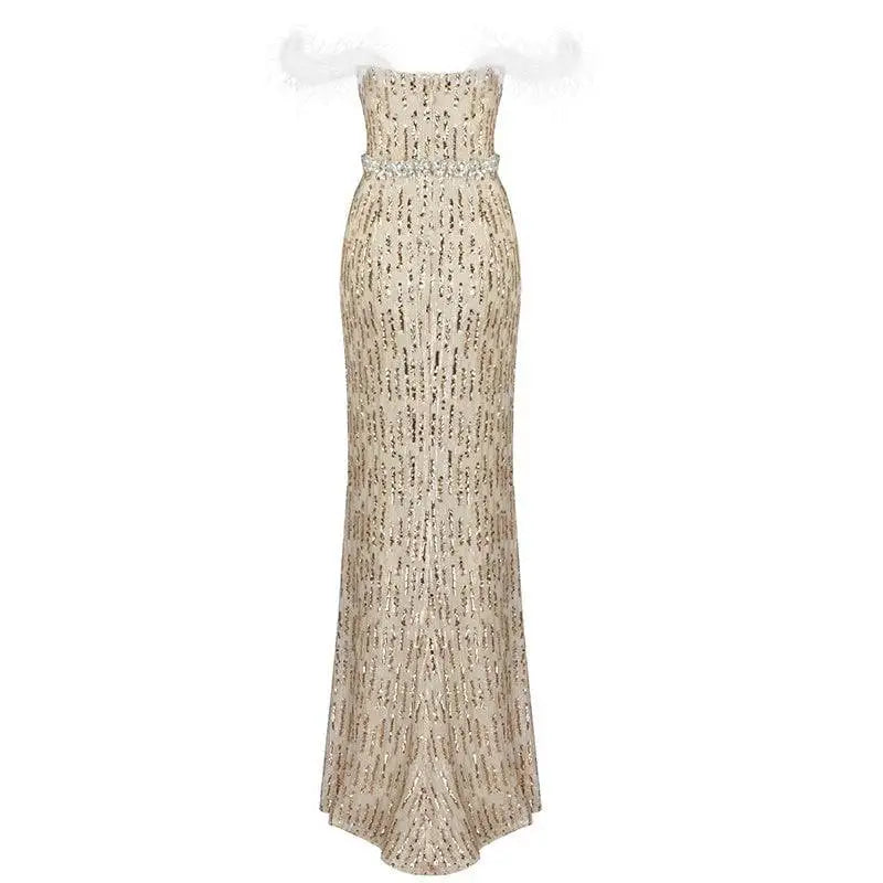A shimmering champagne sequin evening dress featuring feather raglan large sleeves and an elegant beaded belt at the waist