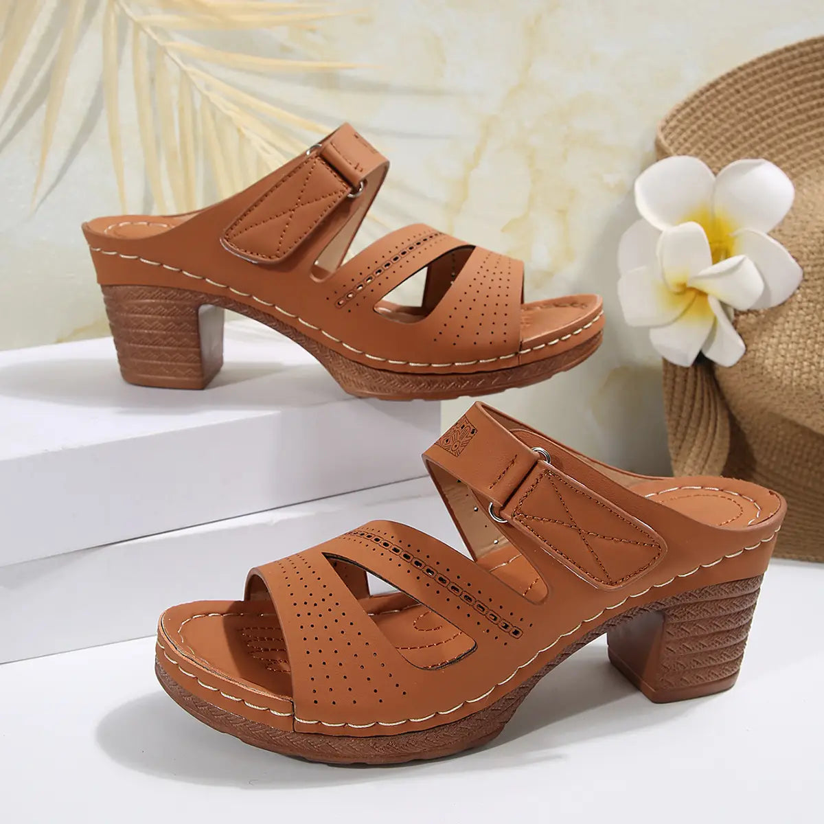 Tan leather summer casual chunky heel sandals featuring decorative perforated straps and a chunky block heel ideal for slides shoes summer wear.