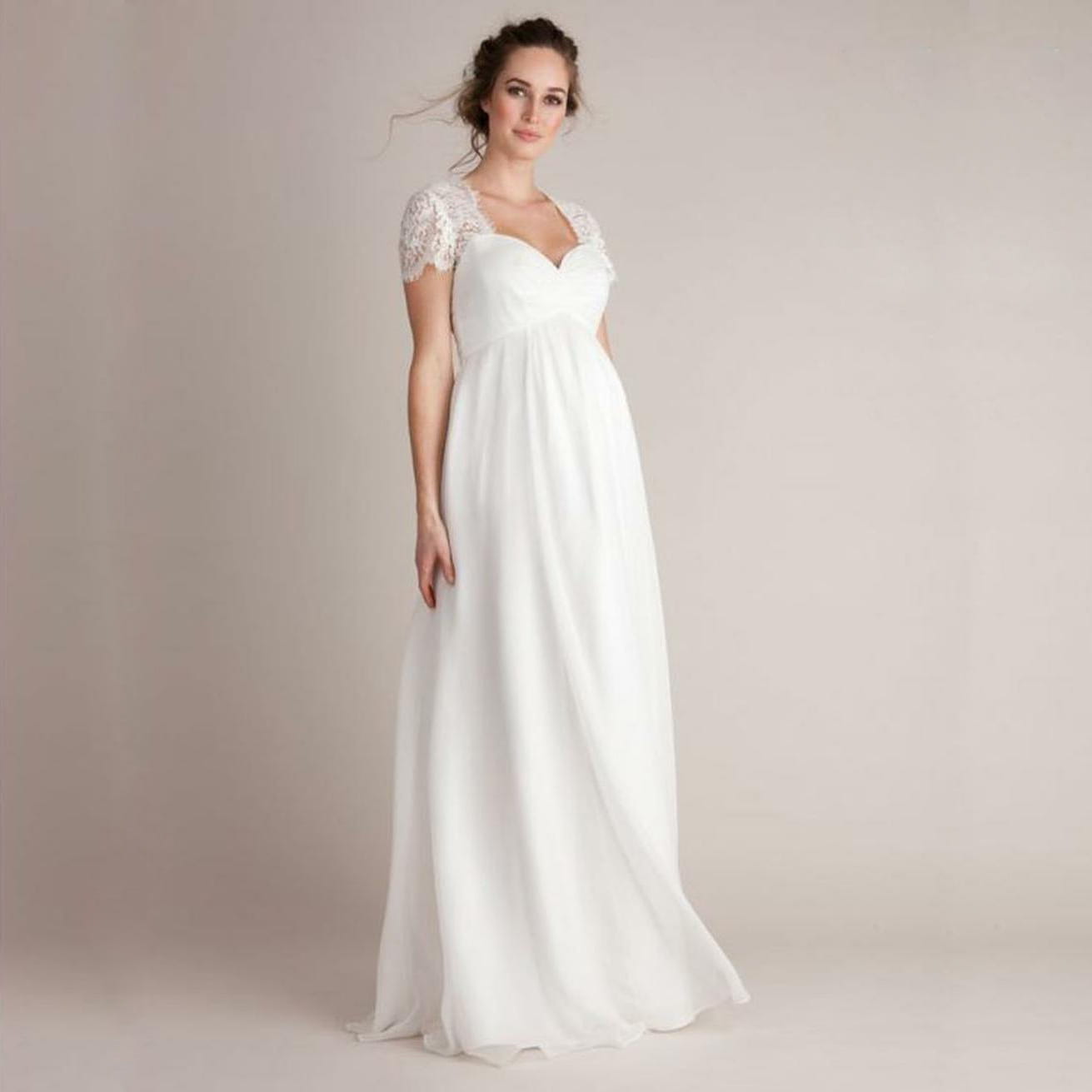 a flowing white wedding gown made of stitching japanese cotton featuring eyelashes lace stitching lace cap sleeves and a sweetheart neckline