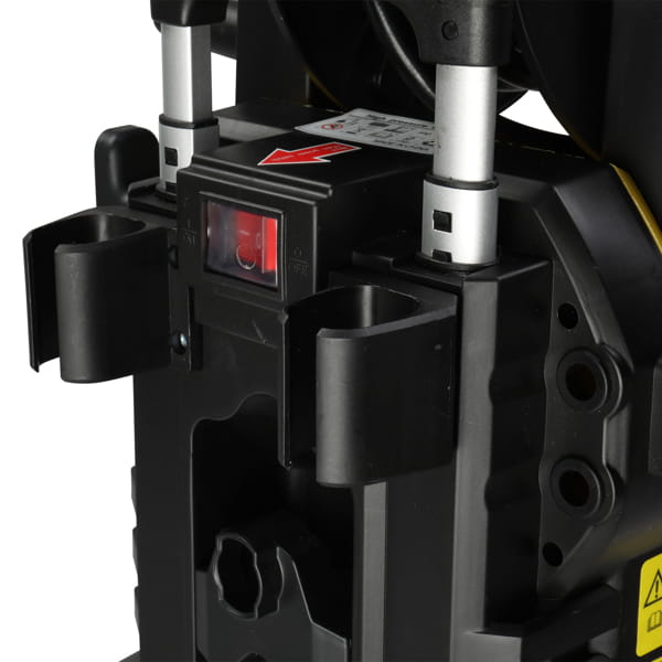 black plastic and metal power tool with red illuminated switch on yellow high pressure cleaning machine with hose reel designed for pressure cleaning use