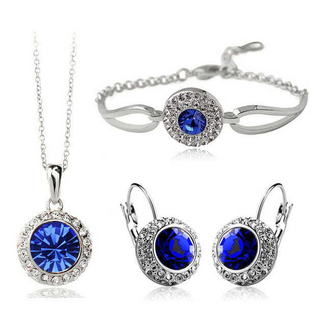Korean style jewelry set featuring elegant silver-toned pieces with vibrant royal blue crystals encircled by sparkling clear stones, ideal for a sophisticated fruit green-inspired look.
