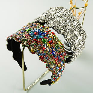 A vibrant baroque colorful headband featuring multi-colored rhinestones and a glittering sequined design.