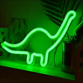 A glowing green neon led modeling light shaped like a long-necked dinosaur decorative night light for bedrooms