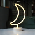 A flamingo led modeling light night light featuring a glowing neon crescent moon with warm yellow light on a white base