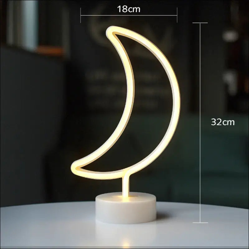 A flamingo led modeling light night light featuring a glowing neon crescent moon with warm yellow light on a white base