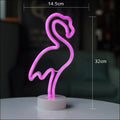 A glowing pink neon flamingo led modeling light night light with a minimalist design and white circular base decorative night light
