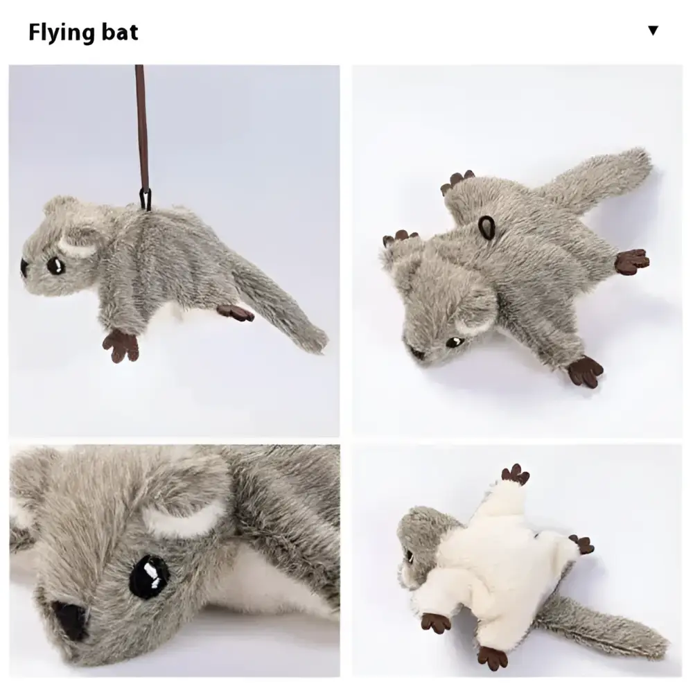 A plush flapping bird cat toy penguin keychain with brown and white fur, yellow beak, black eyes, and feathered tail