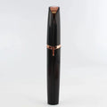 Flawlessly brows electric eyebrow remover featuring a sleek rose gold and black cylindrical design for precise trimming