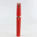 Red cylindrical flawlessly brows electric eyebrow remover with sleek rose gold accents for precise facial hair removal
