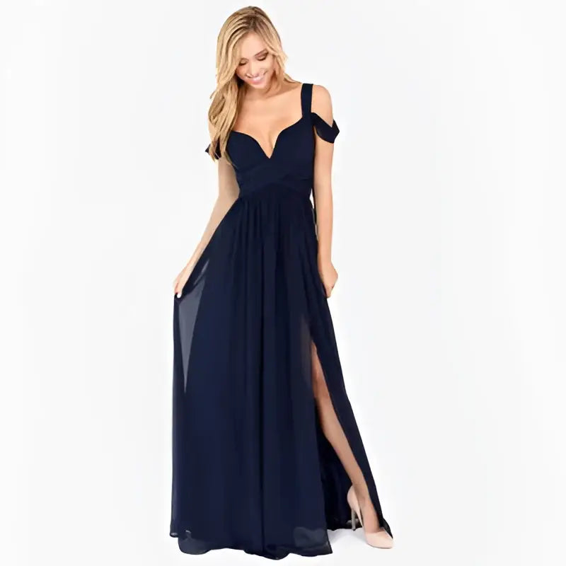 A flowing navy blue chiffon floor length elegant greek style maxi dress with sweetheart neckline and off the shoulder straps