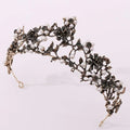 An ornate floral black diamond pearl baroque bridal crown with blackened metal floral and leaf designs adorned with pearls