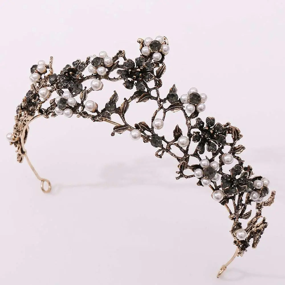 An ornate floral black diamond pearl baroque bridal crown with blackened metal floral and leaf designs adorned with pearls