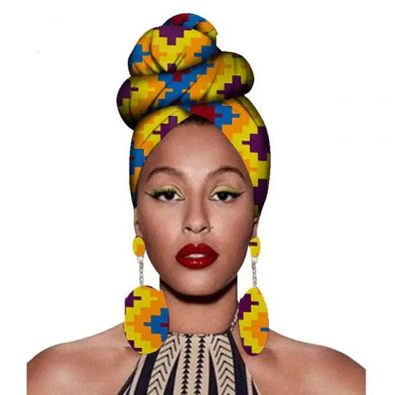 Vibrant yellow blue and purple geometric-patterned fashion african headscarves styled in a high bun with earrings set