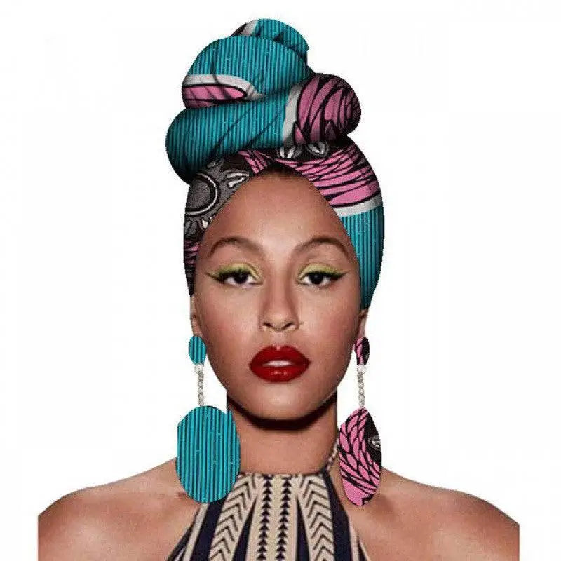 A vibrant teal and pink fashion african headscarves with bold geometric designs in a floral earrings set