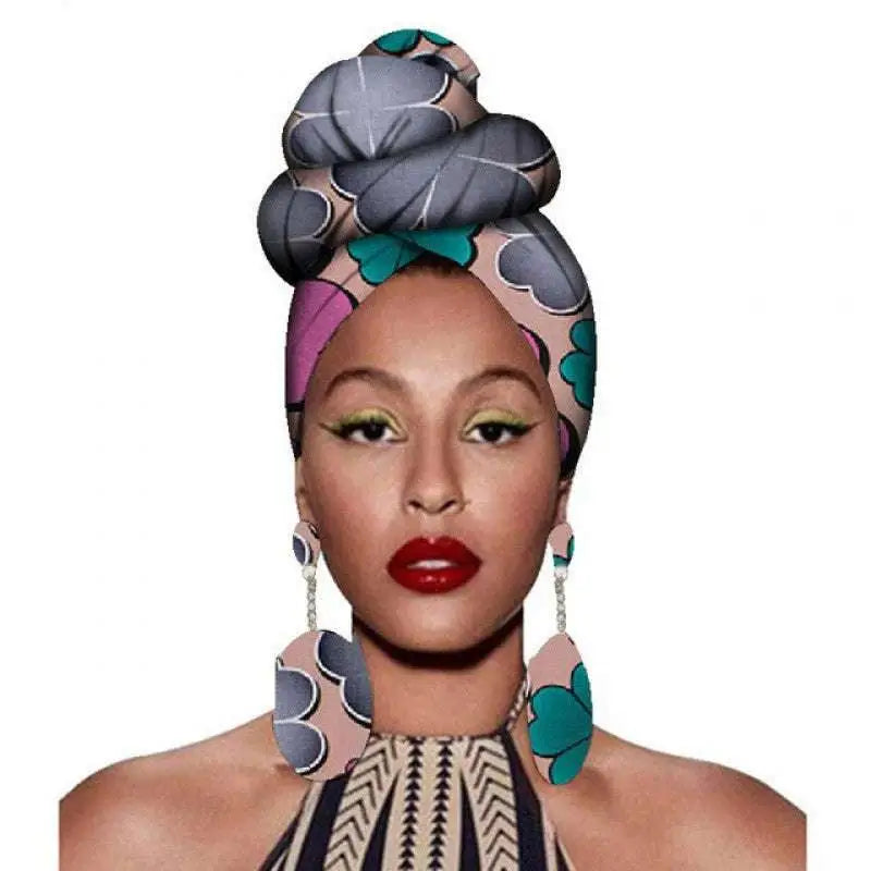 A vibrant fashion african headscarves set featuring a bold gray pink and teal floral patterned headwrap in a high bun