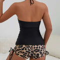 Black and beige leopard-print two-piece swimsuit with strapless top and side ties for a printed halter bikini look