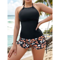 Black halter top paired with orange and white floral shorts in a floral halterneck printed halter split swimsuit design