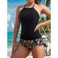 Black halter top paired with leopard-print shorts styled with a floral halterneck printed halter split swimsuit look