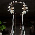 Elegant gold-toned floral hanfu tassels girls fashion headband with white flowers, translucent leaves, blue ribbons, and pearls