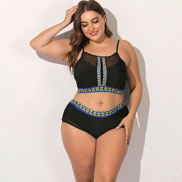 Black plus-size two-piece female swimsuit with sheer mesh panels and vibrant floral mesh embroidery on neckline and waistband