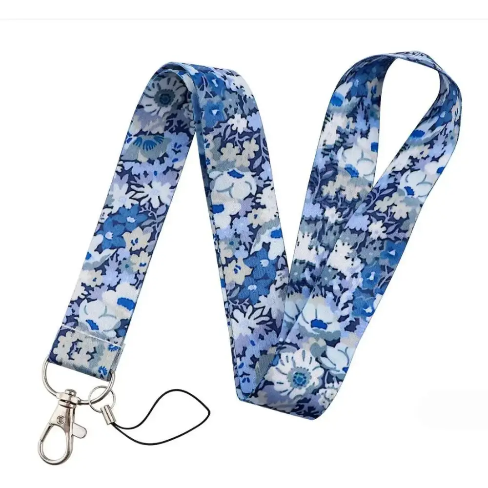 Floral molly mobile phone strap featuring blue and white floral fabric with a silver metal clasp for secure use