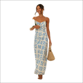 Floral print maxi dress in white with a delicate blue pattern and thin spaghetti straps featuring a swing skirt