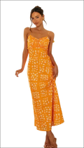 A vibrant orange floral print maxi dress with delicate white blossoms and a flowing swing skirt with spaghetti straps