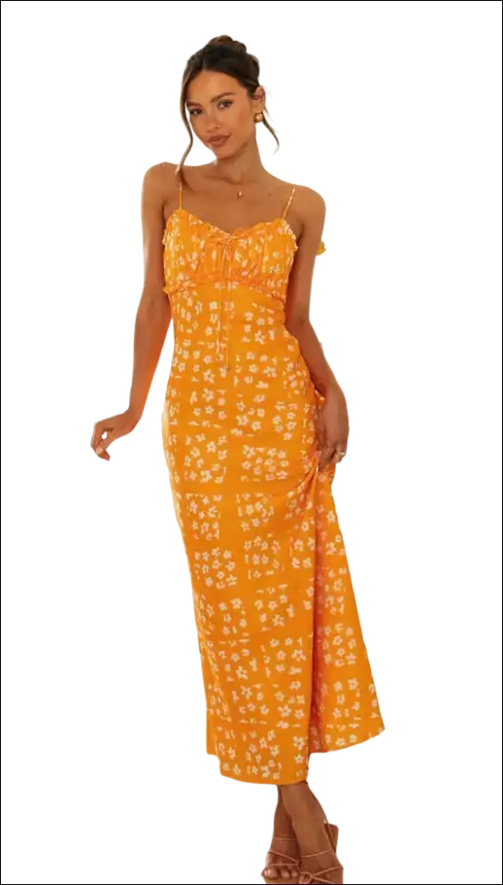 A vibrant orange floral print maxi dress with delicate white blossoms and a flowing swing skirt with spaghetti straps