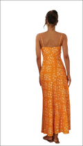 A vibrant orange floral print maxi dress with a delicate white pattern, thin spaghetti straps, and a flowing swing skirt