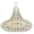 A delicate ivory cathedral length bridal lace veil with intricate floral embroidery and scalloped edges