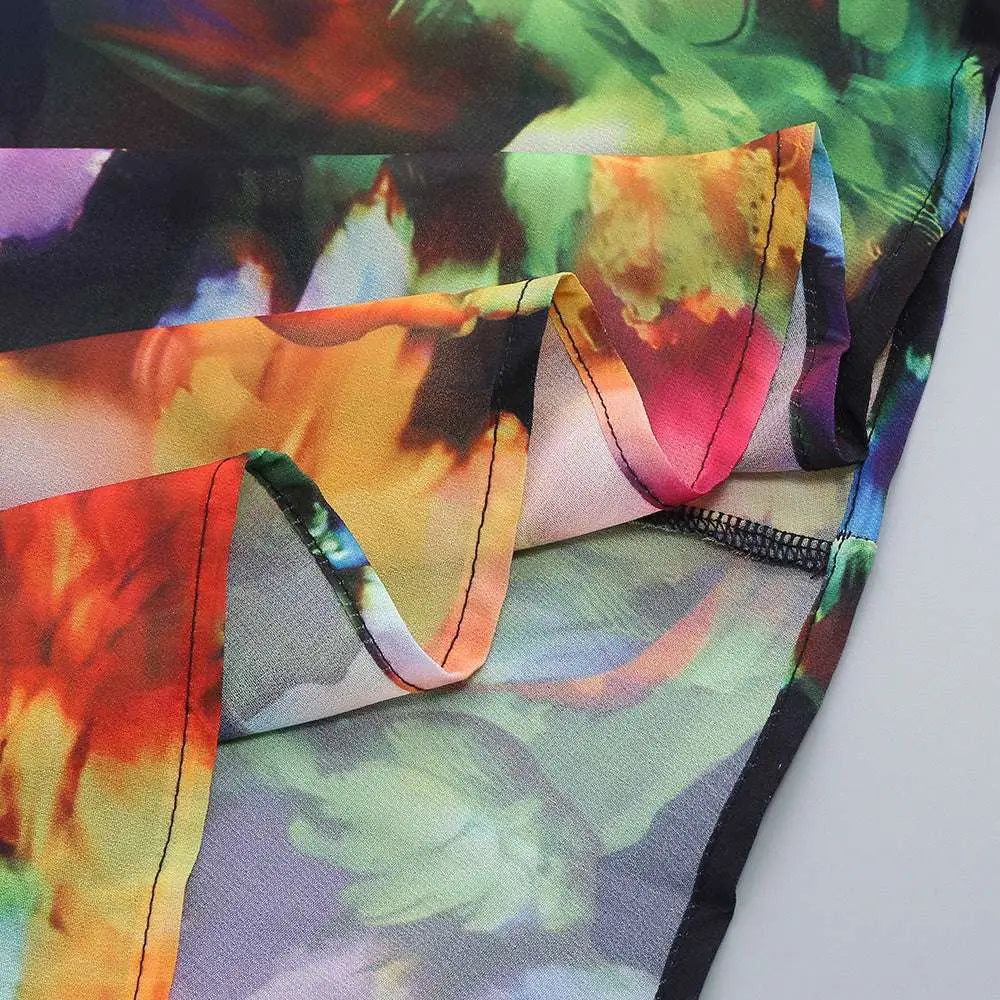 Vibrant tie-dye floral v-neck split comfort casual dress with swirling red orange green and purple patterns