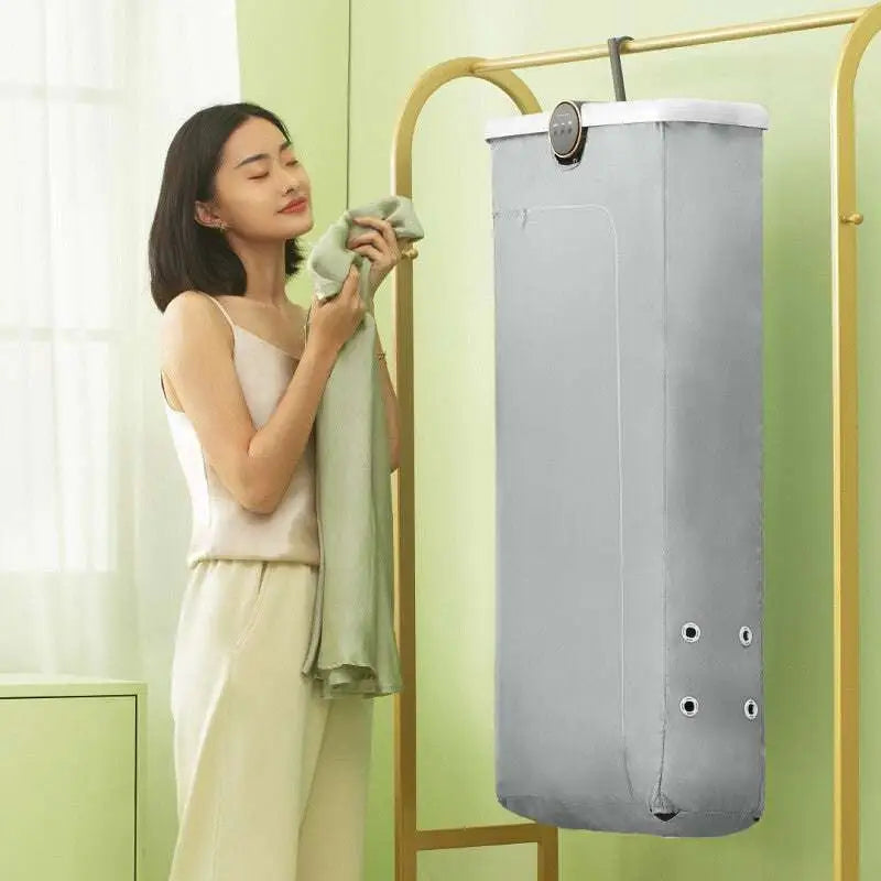 Gray fabric foldable clothes household small quick dryer with circular control panel and four white grommets along side