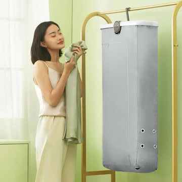 Gray fabric foldable clothes household small quick dryer with circular control panel and four white grommets along side