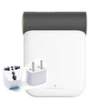 White and gray travel adapter set with gold accents complementing a foldable small quick dryer with circular control panel and gray fabric