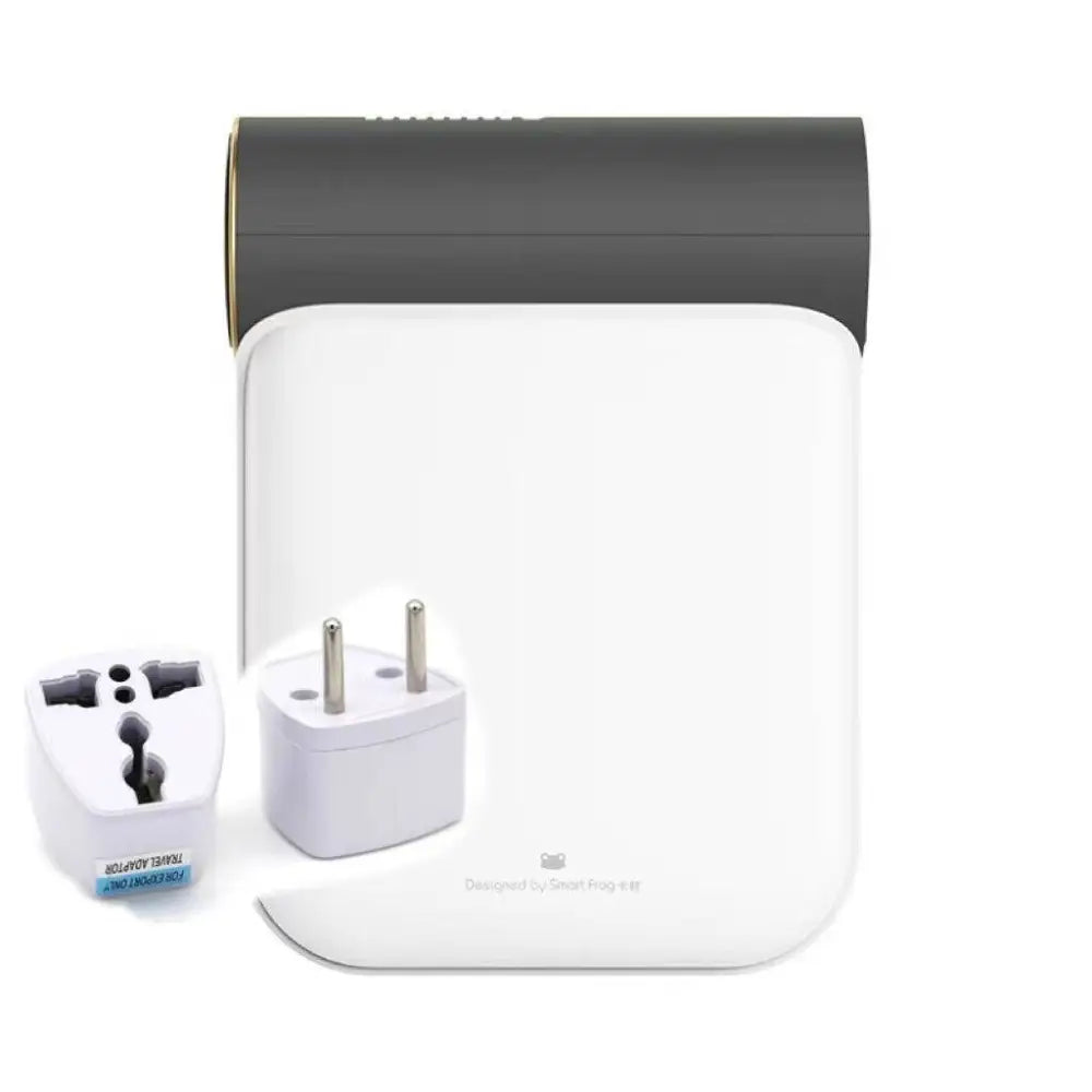 White and gray travel adapter set with gold accents complementing a foldable small quick dryer with circular control panel and gray fabric