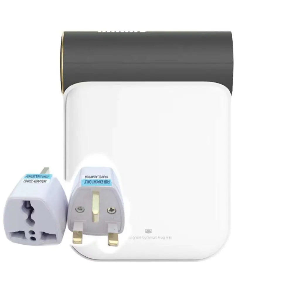 White and gray travel adapter with gold accents and two interchangeable plug heads for small quick dryer use with gray fabric