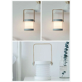 A foldable touch dimmable portable lantern with sleek metallic handle and soft diffused light for reading and outdoor use