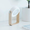 Minimalist white led foldable touch dimmable table lamp with light wood base and circular head for reading