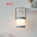 Gray foldable touch dimmable portable lantern with wooden handle emitting warm diffused light for reading use